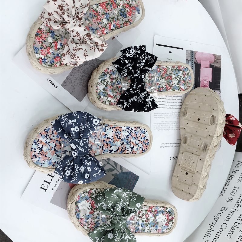 Close-up view of lace texture and craftsmanship on women's slippers