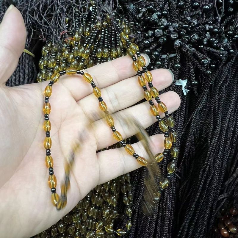 قلادة الخرز غير القابلة للتنظيم في قلادة تايجر، المحبوسة يدويا في القلادة الكهرمانية Item Picture