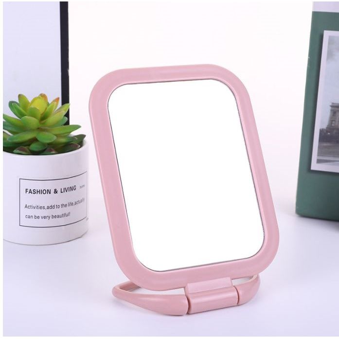 Hand-held vanity mirror