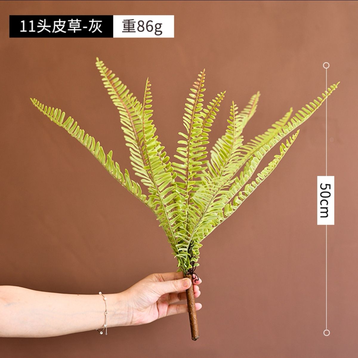 Venta al por mayor de alta gama simulación flor piel verde planta plástico flor falsa adecuado para el hogar decoración dormitorio diseño de montaje suave fondo decoración de pared flores artificiales decoración floral boda