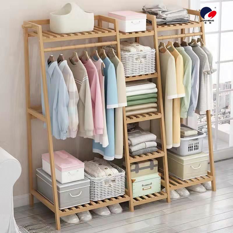 The floor-standing clothes hanger for the bedroom is simple and elegant. It is a modern solid wood clothes hanger cabinet for home use with tree branches on the floor Specification image