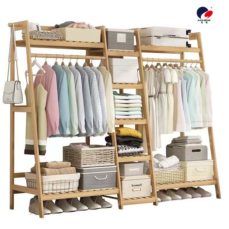 The floor-standing clothes hanger for the bedroom is simple and elegant. It is a modern solid wood clothes hanger cabinet for home use with tree branches on the floor details Picture