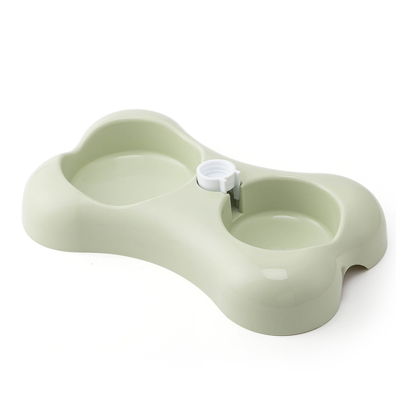 Dog playfully bumping New Pet Double Bowl without tipping