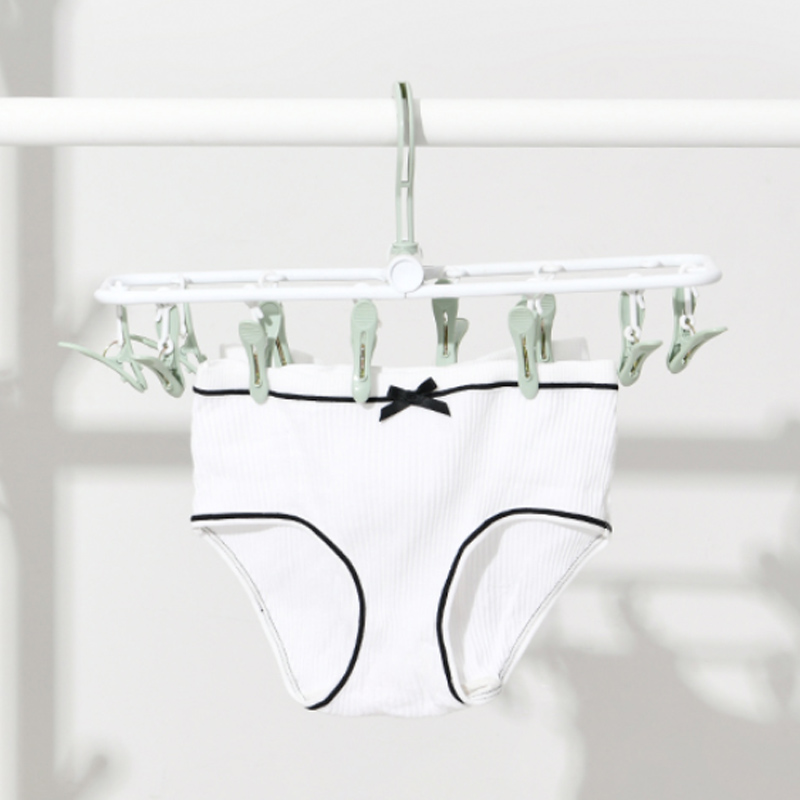 Foldable multi-functional multi-clip clothes hanger, portable travel magic inner page, underwear and sock clip, plastic clothes drying clip Application Scenario