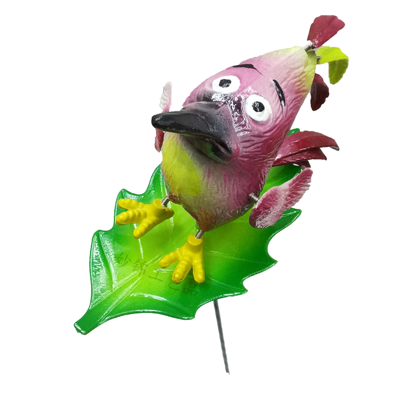 Close-up of colorful feather details on the three-tailed bird decor