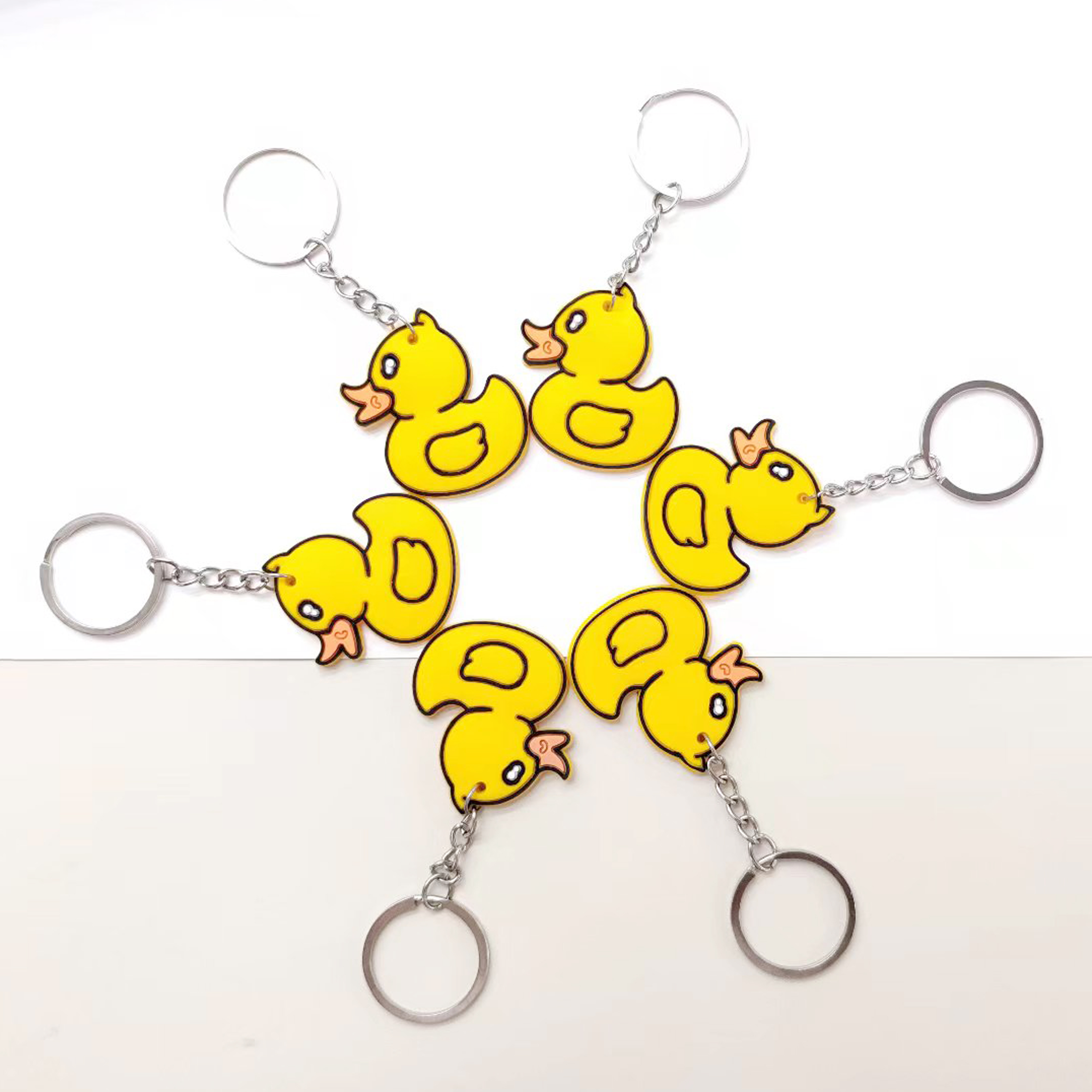 Wholesale cartoon PVC soft rubber little yellow duck keychains, personalized pendants, small gifts and cute accessories Item Picture