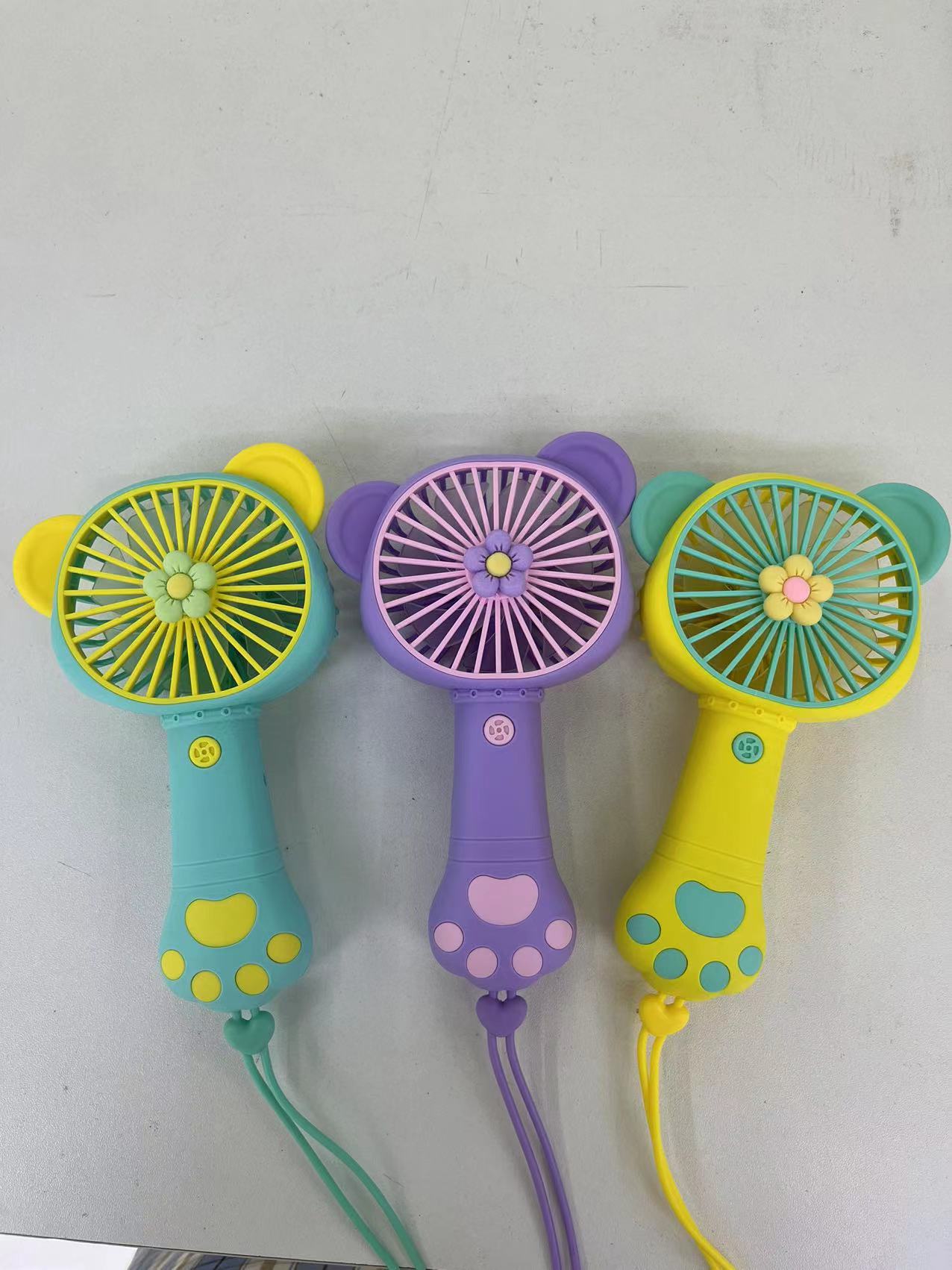 The 2222A mini fan comes in four colors: pink, purple, yellow and green. It is a handheld fan with a single-speed wind force and is easy to carry pic 1
