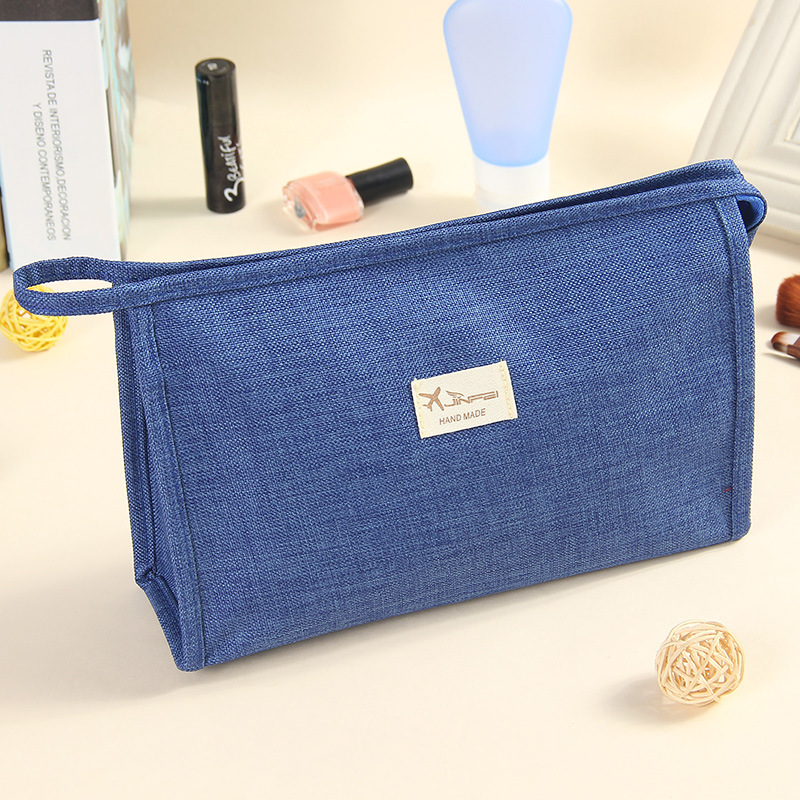 2022 New Makeup Bag Female Portable Simple Korean Version Travel Canvas Storage Bag Solid Color Hand Can Print Logo Application Scenario