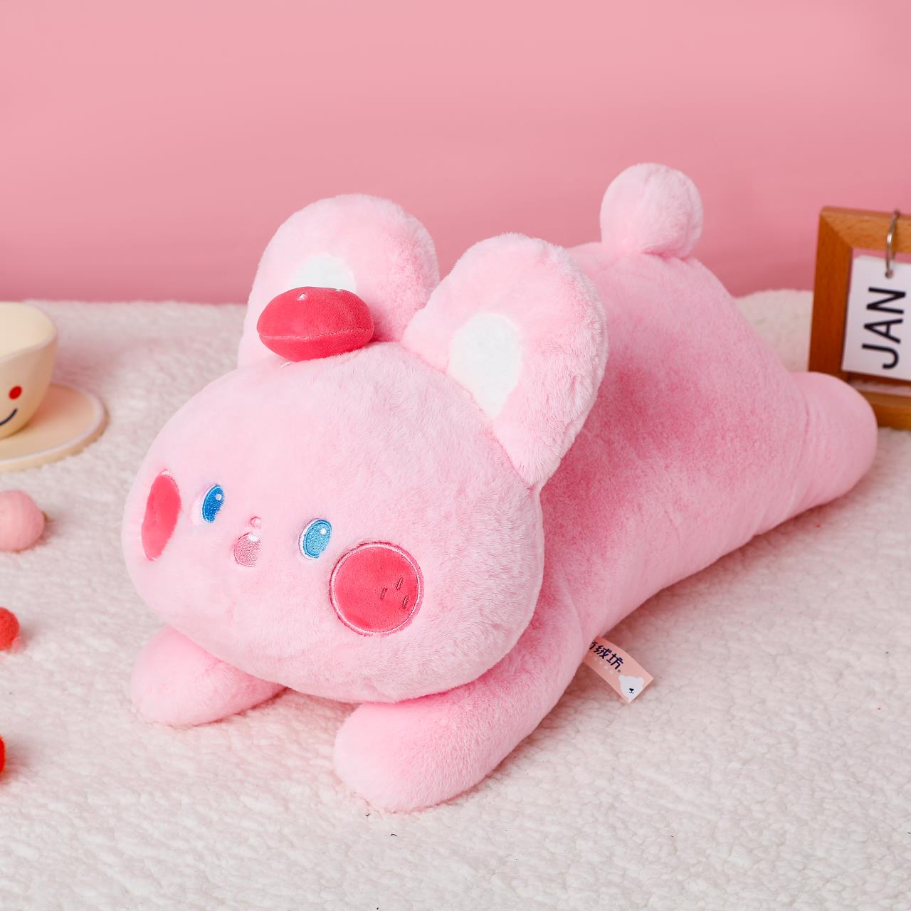 The cute strawberry pink rabbit plush pillow is decorated with a cute shape, is skin-friendly and delicate, and has a smooth touch pic 5