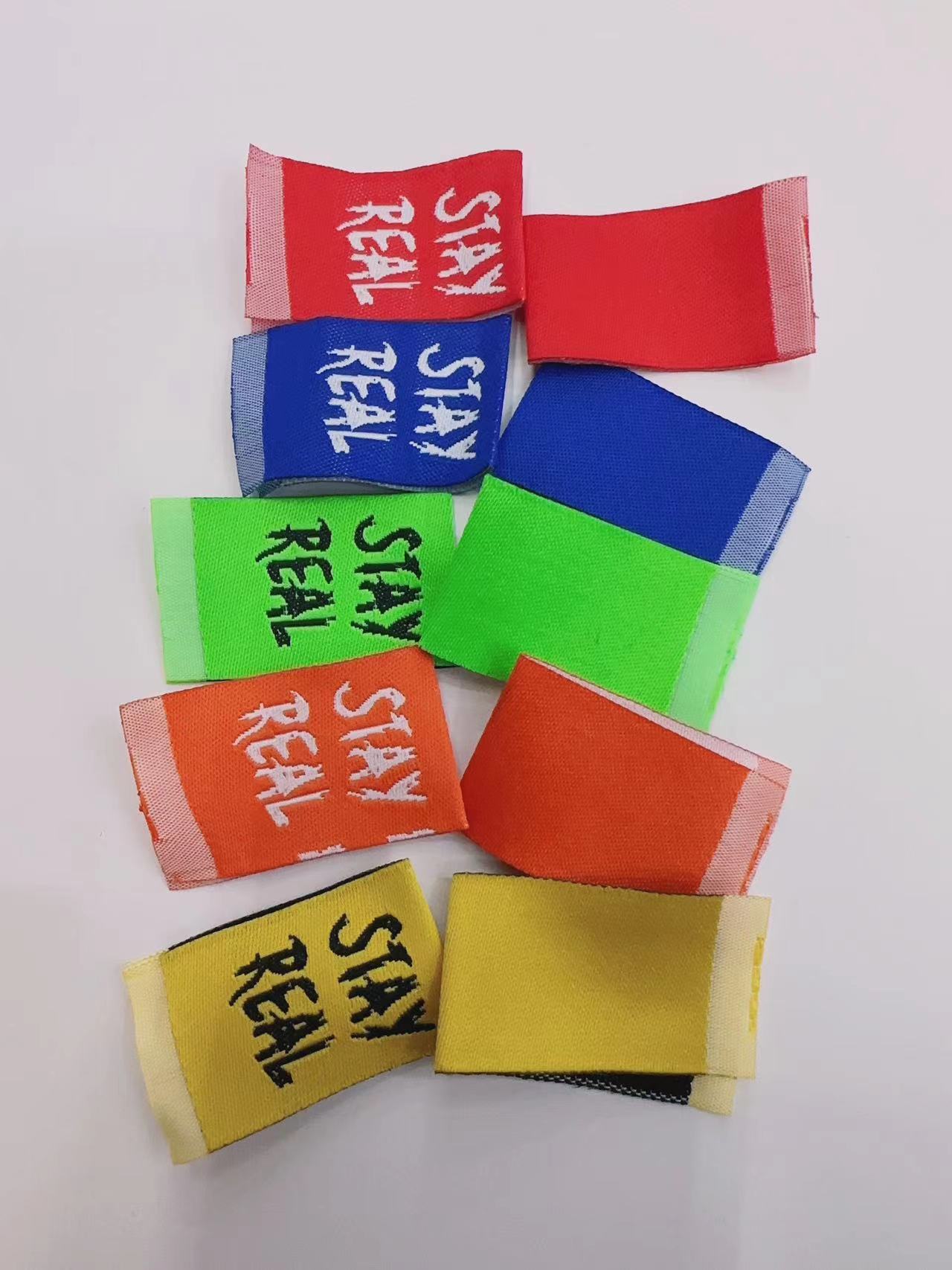 Stay Real Clip Labels White On Red, White On Blue, White On Orange, Black On Green, Black On Yellow