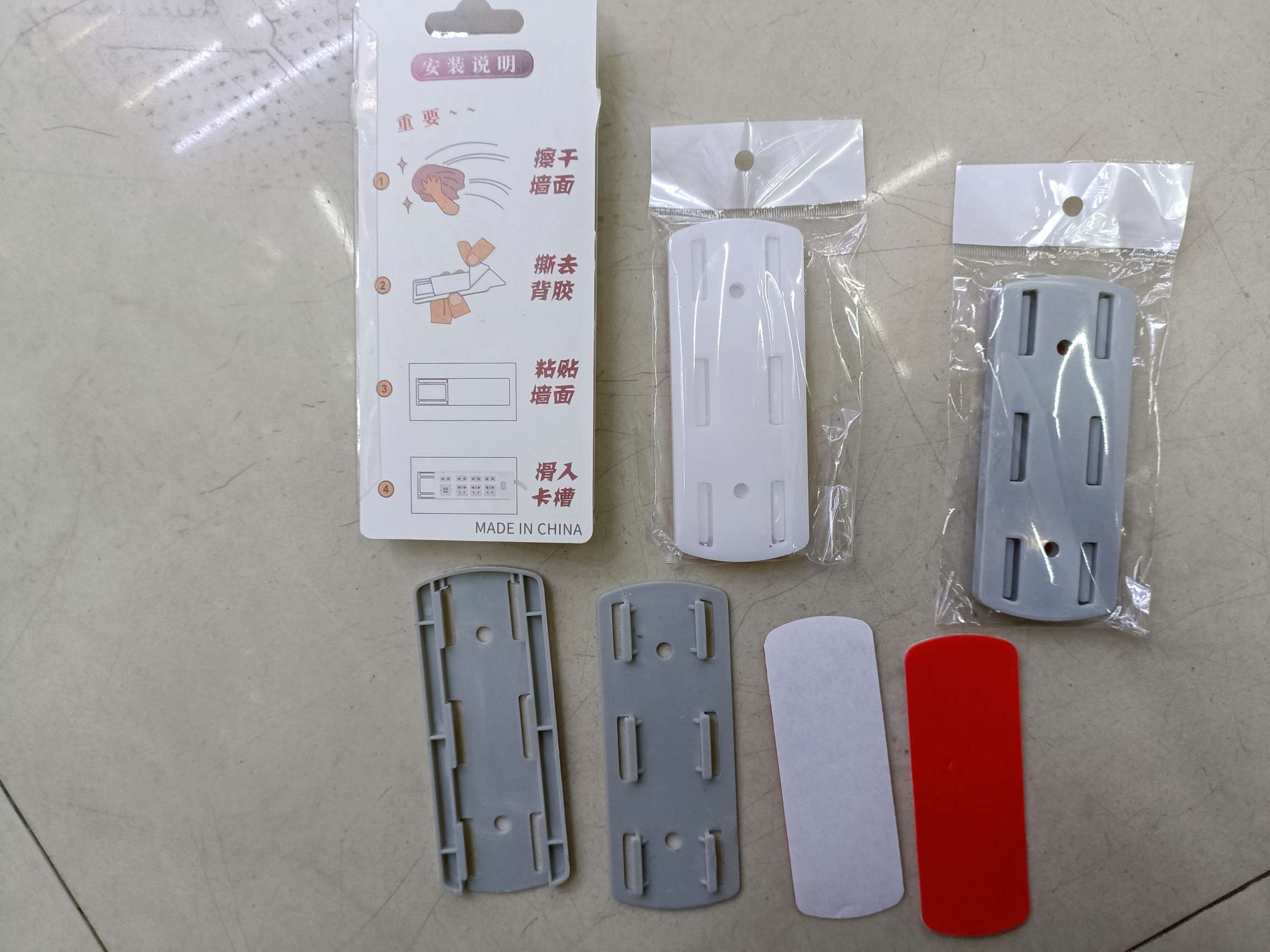 Stick-on socket retainer for wall-mounted storage seamless socket retainer details Picture