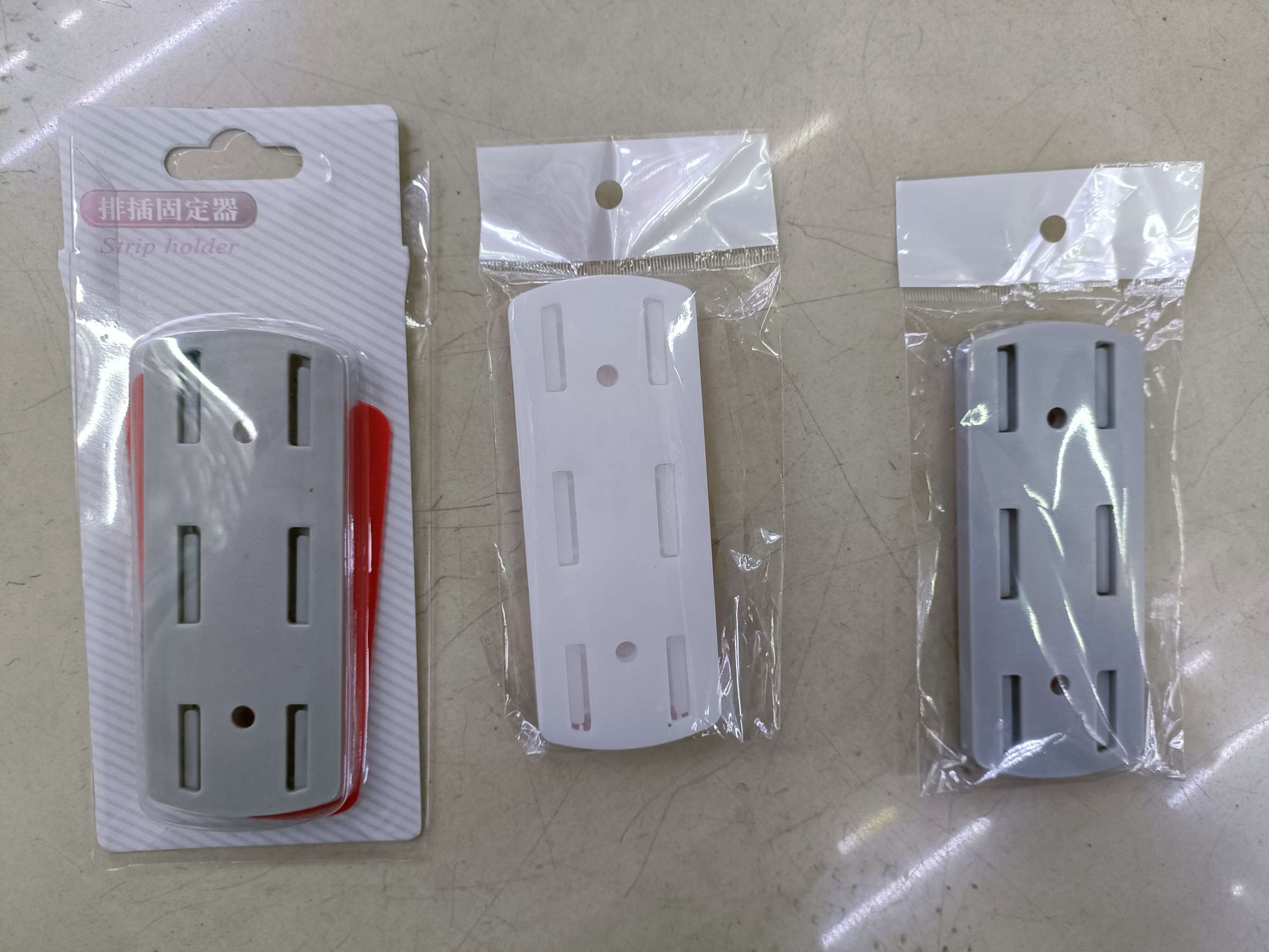 Stick-on socket retainer for wall-mounted storage seamless socket retainer full figure