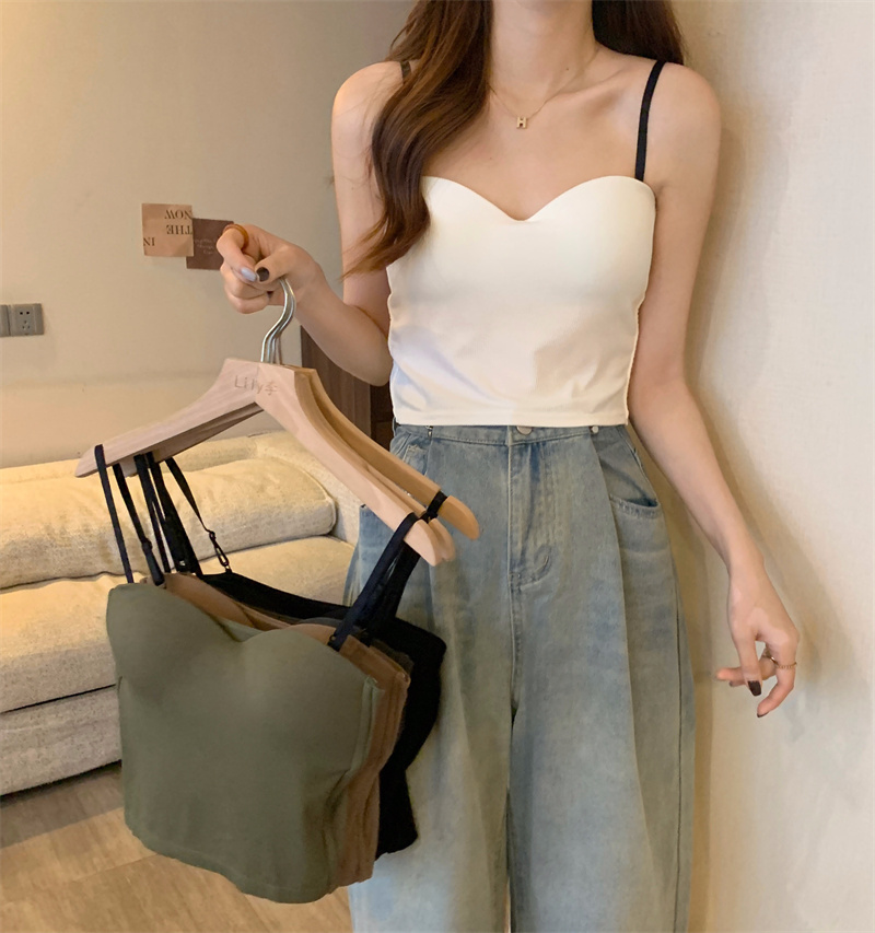 For winter women, wear a French-style small halter top with a cushioned base layer inside and a sleeveless, slimming short top outside