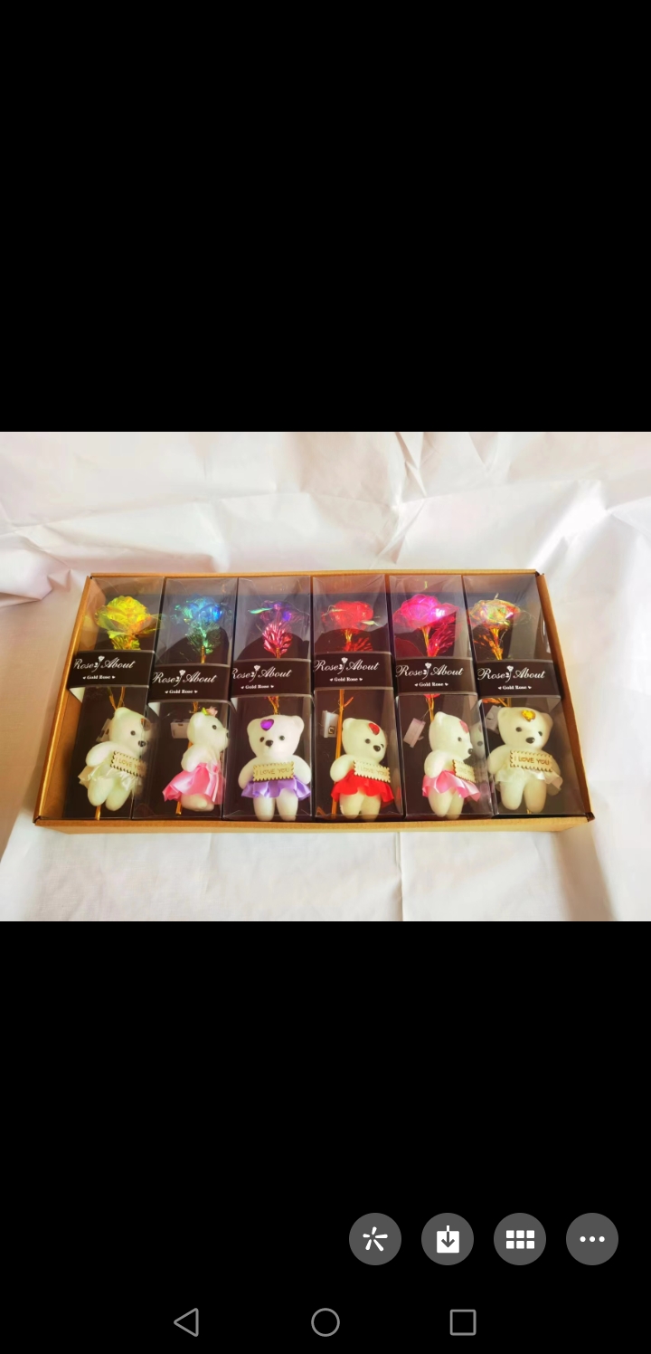 A single rose with gold foil in a transparent box and a bear as a Teachers' Day and Valentine's Day gift