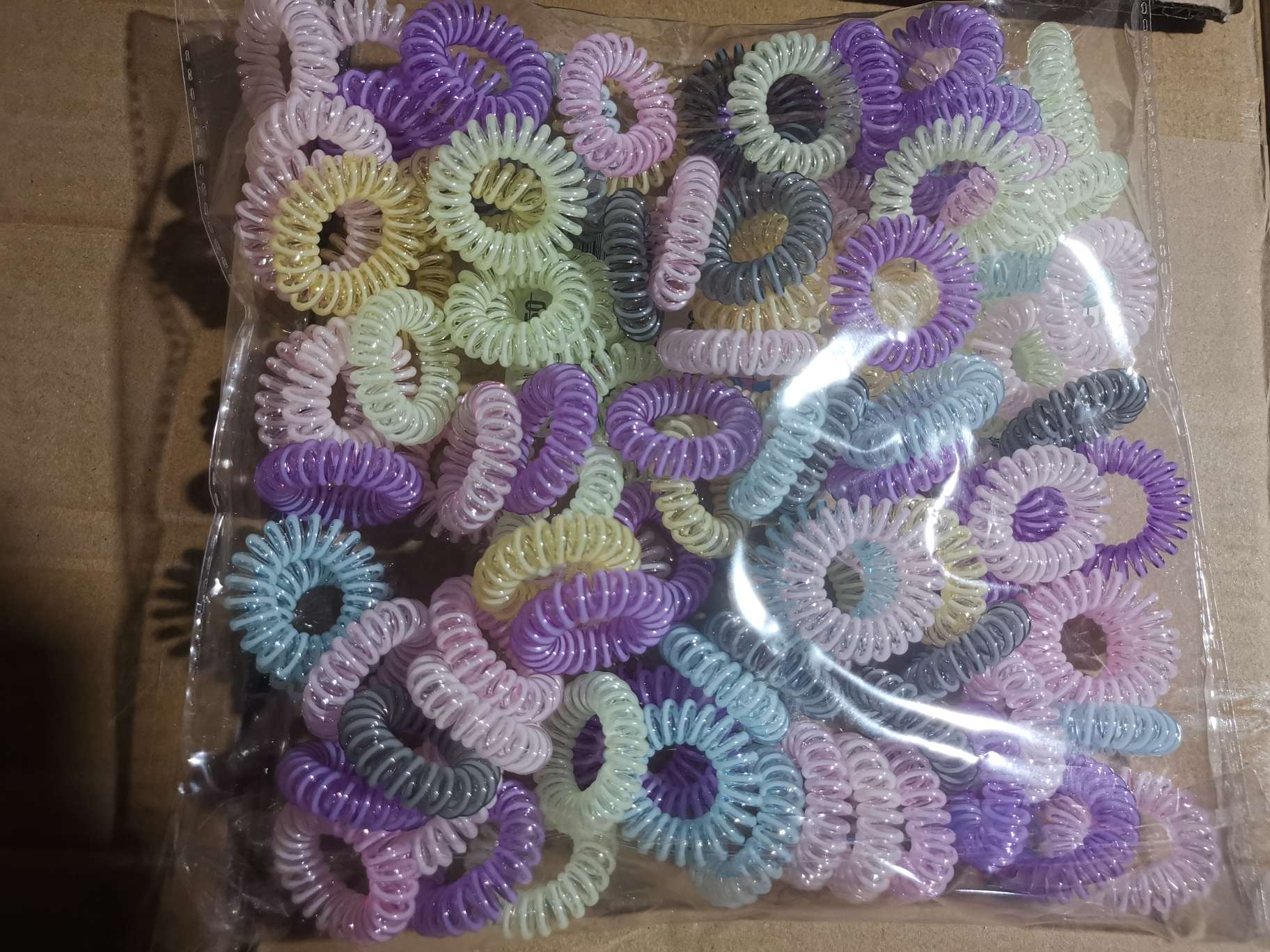 A bag of 100 pieces of a mix of telephone line, high-elasticity and thickened wristbands, hair styling accessories and mixed colors Application Scenario