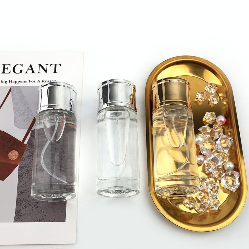 Factory direct sales of 50ML transparent straight round perfume glass bottles, portable spray dispensing glass bottles, and empty cosmetic bottles details Picture