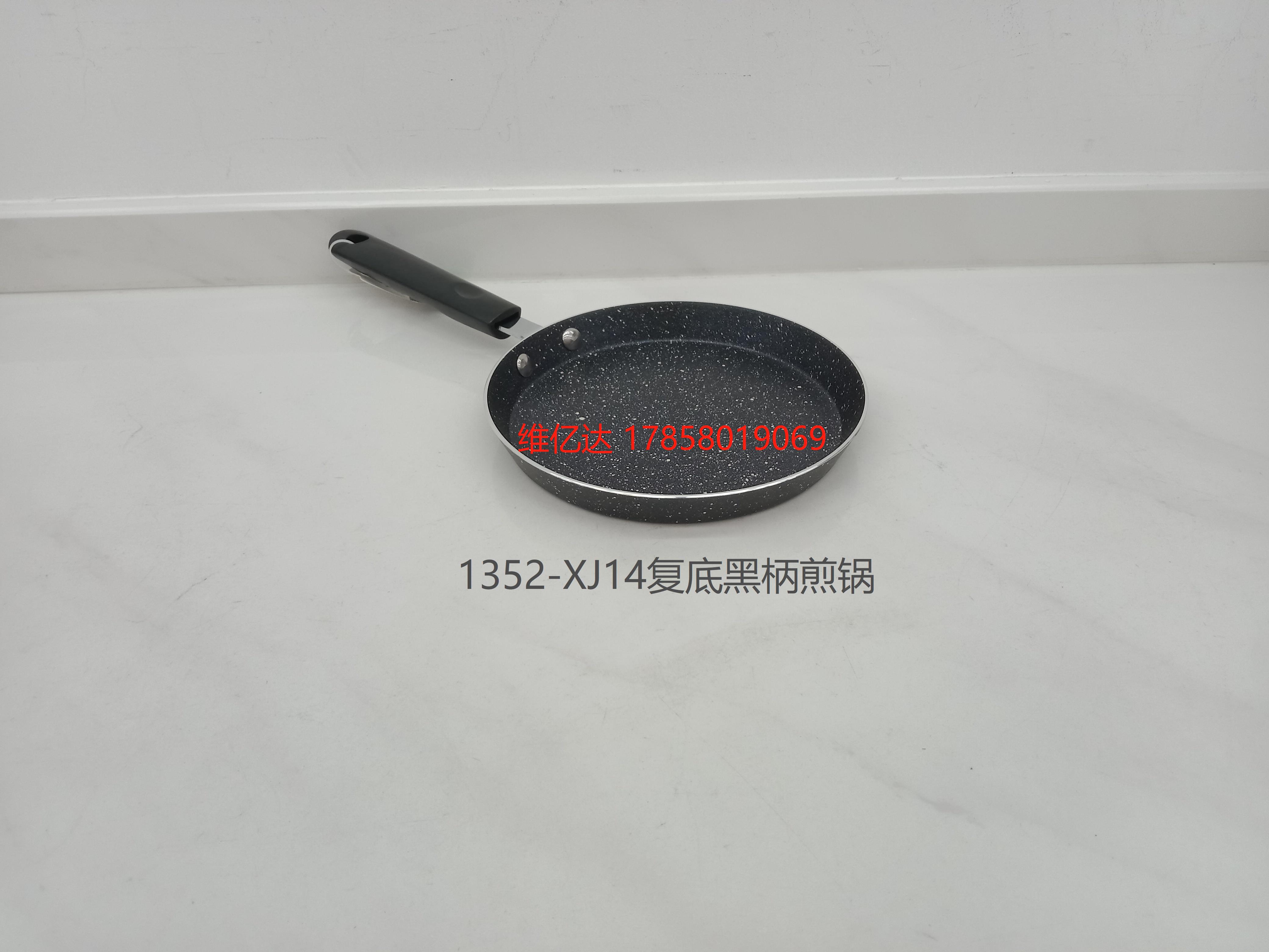 A stainless steel black frying pan with a double bottom