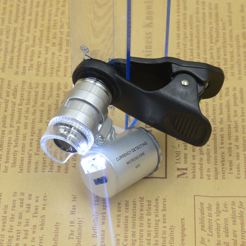Yiwu Jinghui Factory Direct sales: Black 60x mobile phone holder with banknote detector LED light microscope magnifying glass 9882W1