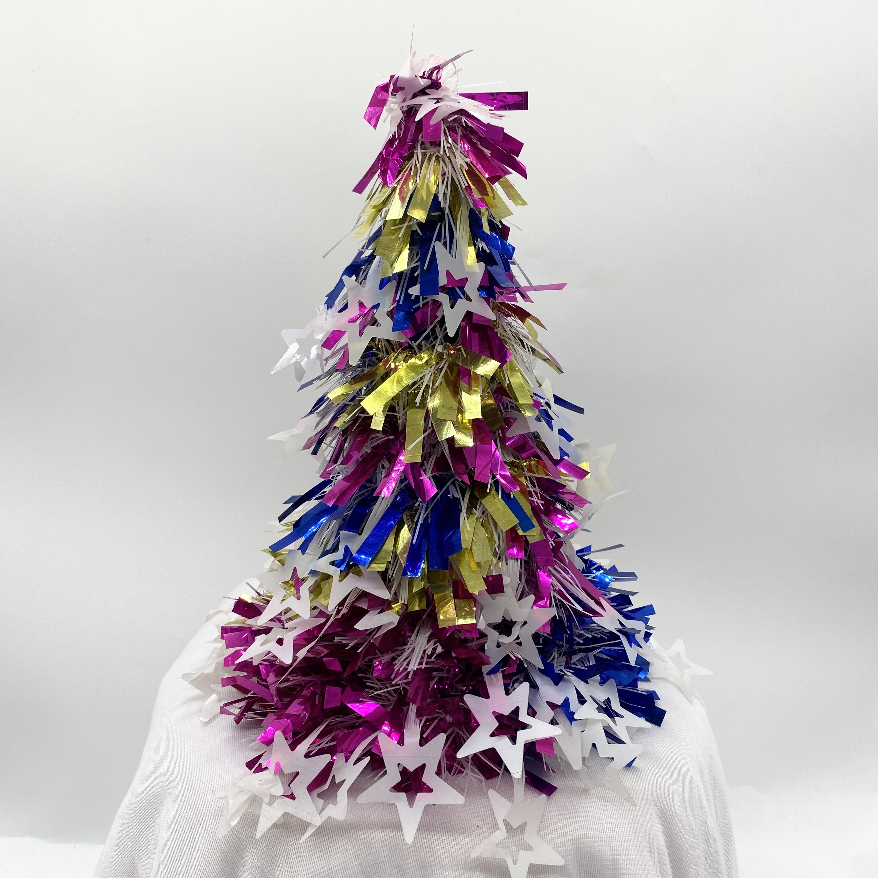 The small tower tree is fringed with five-pointed stars