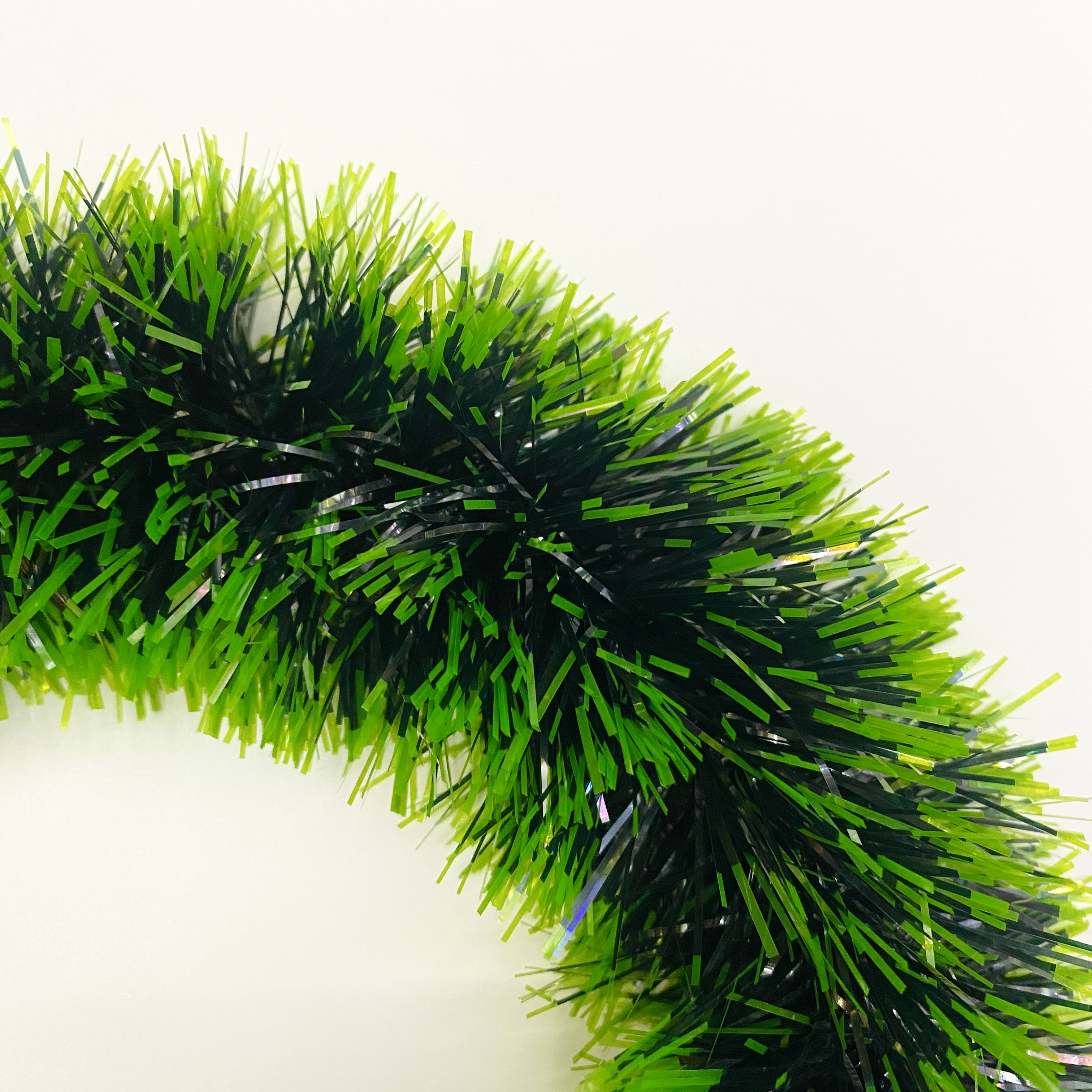A dark green garland with white edges details Picture