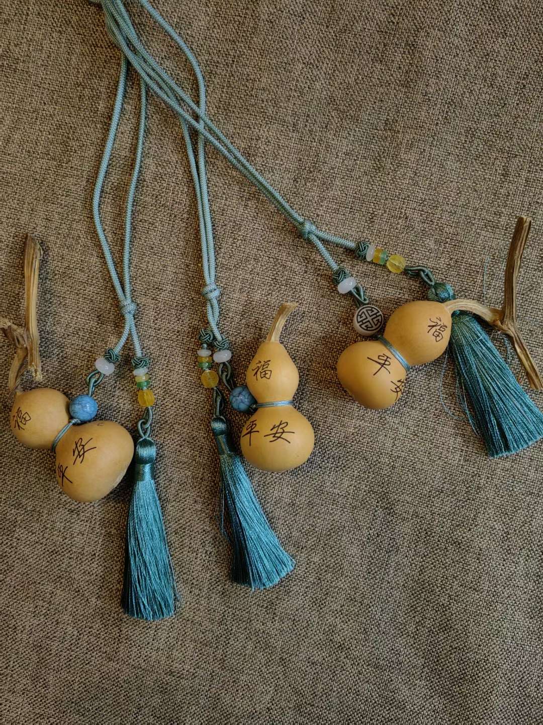 The blue tassel Chinese knot pendant with a peace gourd symbolizes peace, happiness, prosperity, good fortune, and the attraction of wealth and blessings Specification image