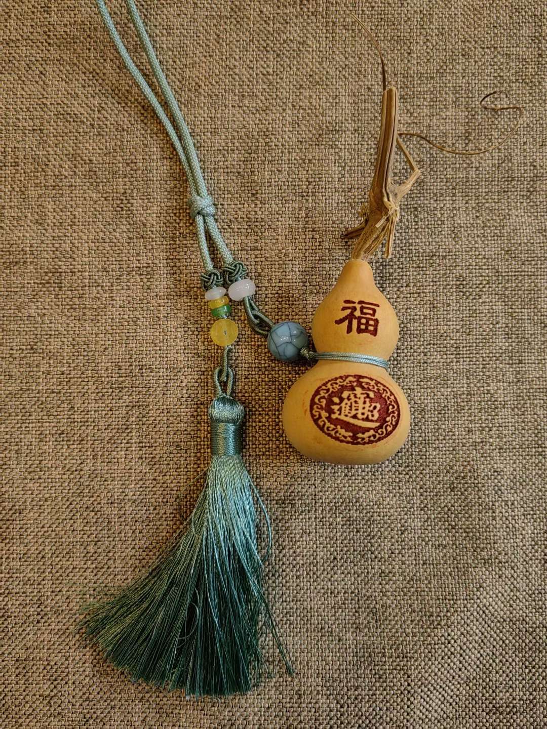 The blue tassel Chinese knot pendant with a peace gourd symbolizes peace, happiness, prosperity, good fortune, and the attraction of wealth and blessings details Picture