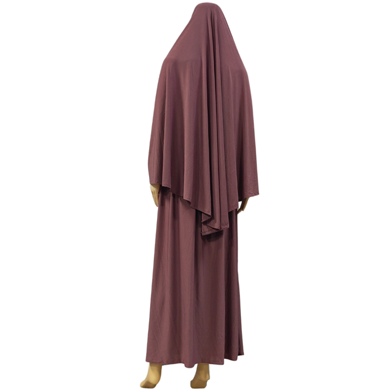 A two-piece Muslim solid-color long dress set is an elegant and fashionable factory bestseller. A two-piece hooded long headscarf skirt set is an elegant and fashionable women's style with a solid color and high quality details Picture