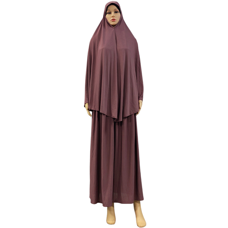 A two-piece Muslim solid-color long dress set is an elegant and fashionable factory bestseller. A two-piece hooded long headscarf skirt set is an elegant and fashionable women's style with a solid color and high quality Specification image