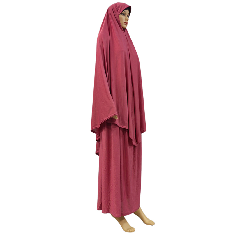A two-piece Muslim solid-color long dress set is an elegant and fashionable factory bestseller. A two-piece hooded long headscarf skirt set is an elegant and fashionable women's style with a solid color and high quality Application Scenario