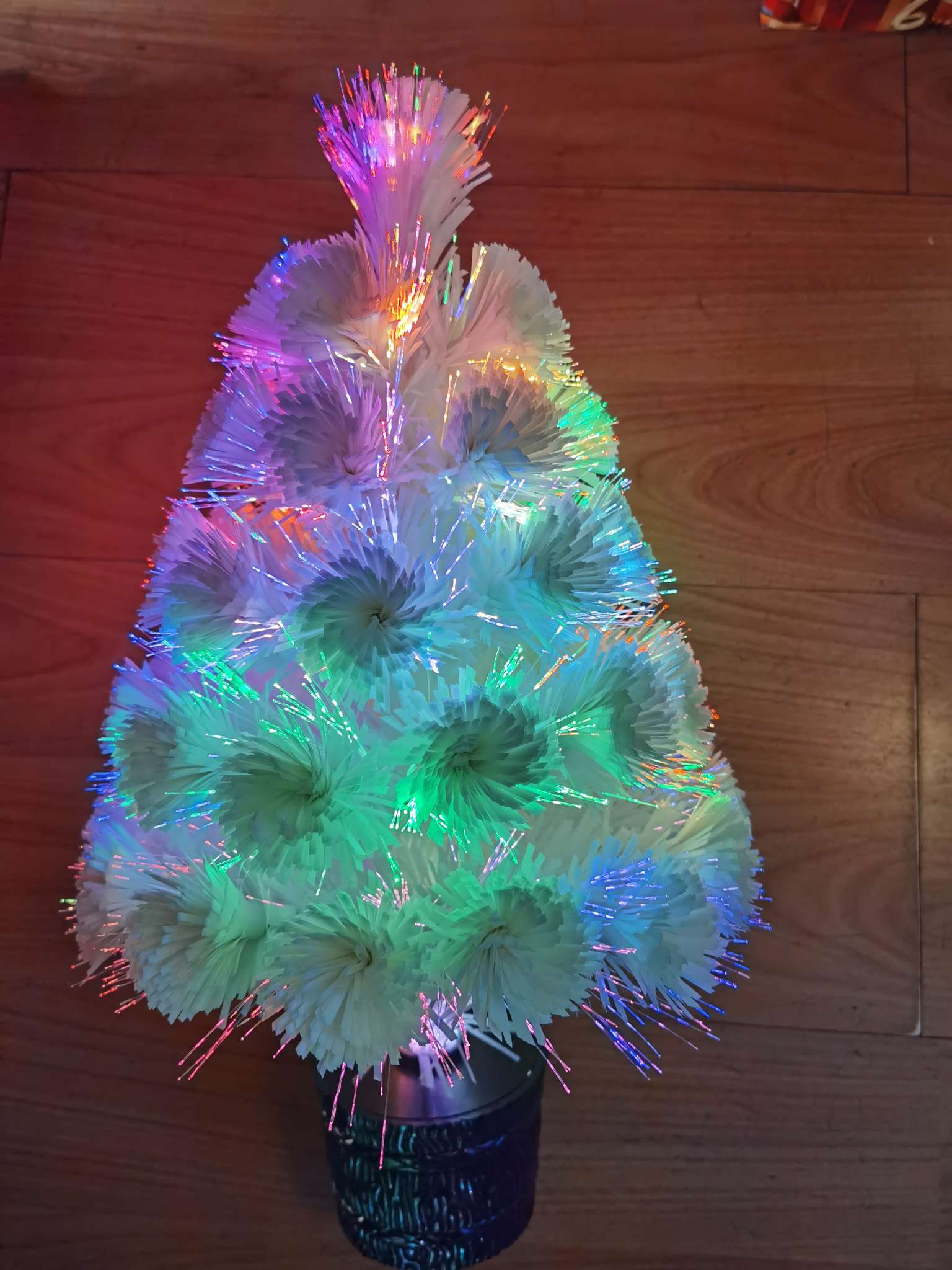 Decorate the fiber optic tree for Christmas