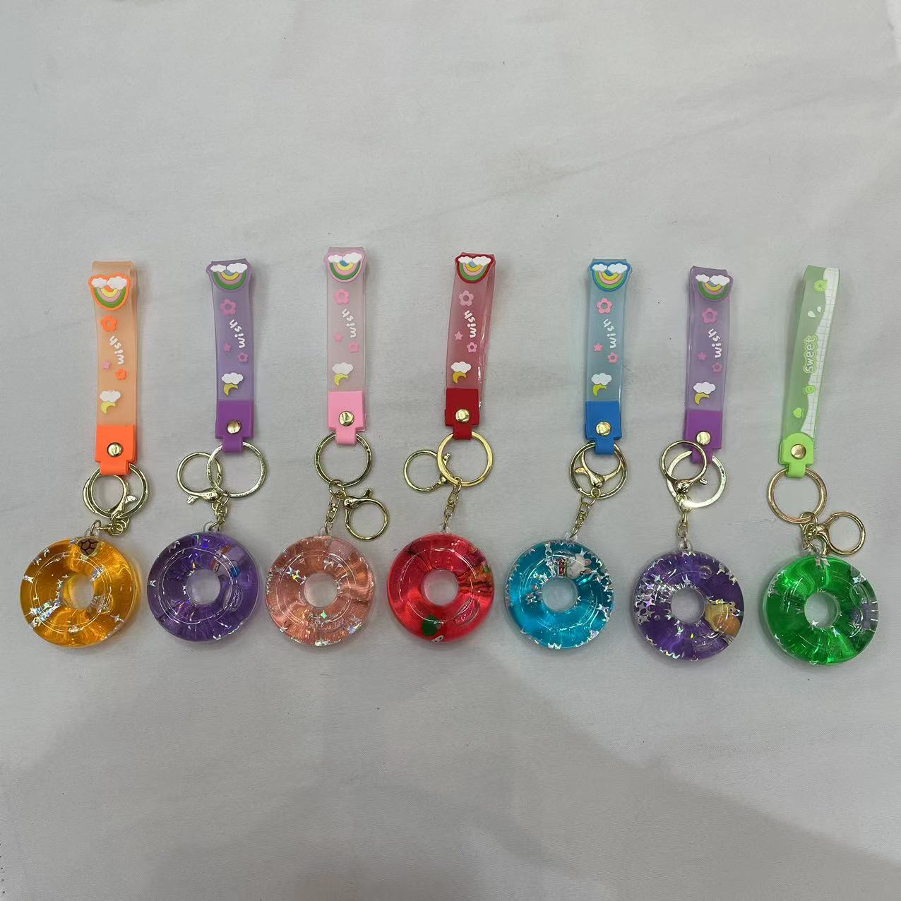 Creative doughnut oil keychain, exquisite and cute quicksand floating bottle, schoolbag pendant accessory, car key pendant
