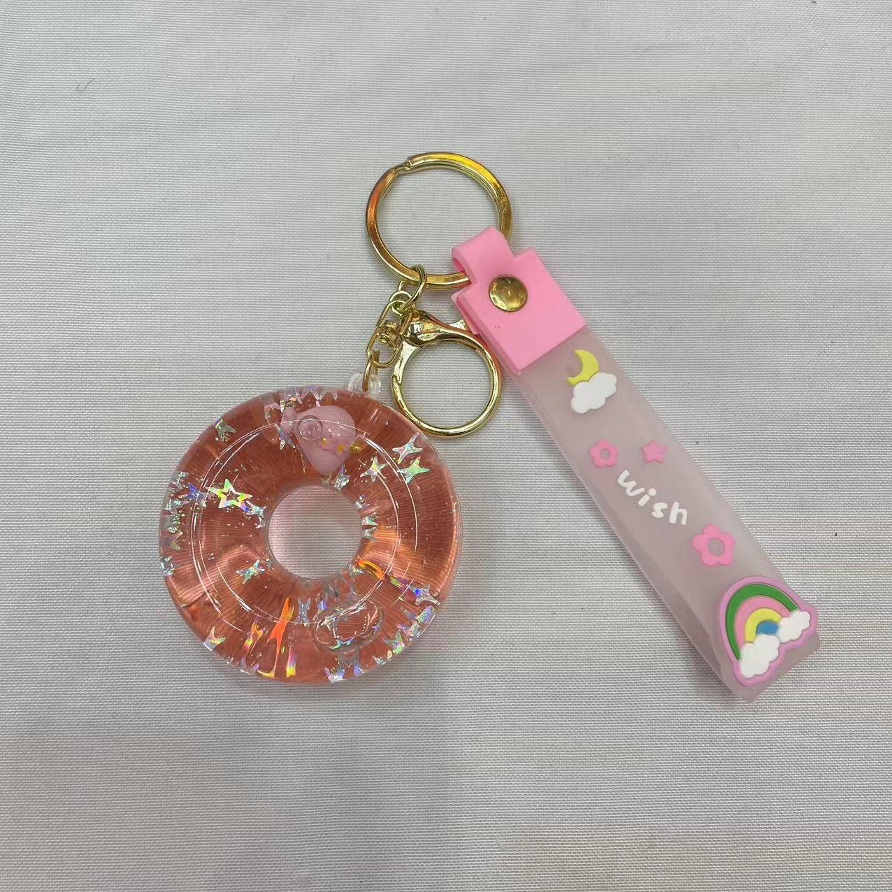Creative doughnut oil keychain, exquisite and cute quicksand floating bottle, schoolbag pendant accessory, car key pendant Application Scenario