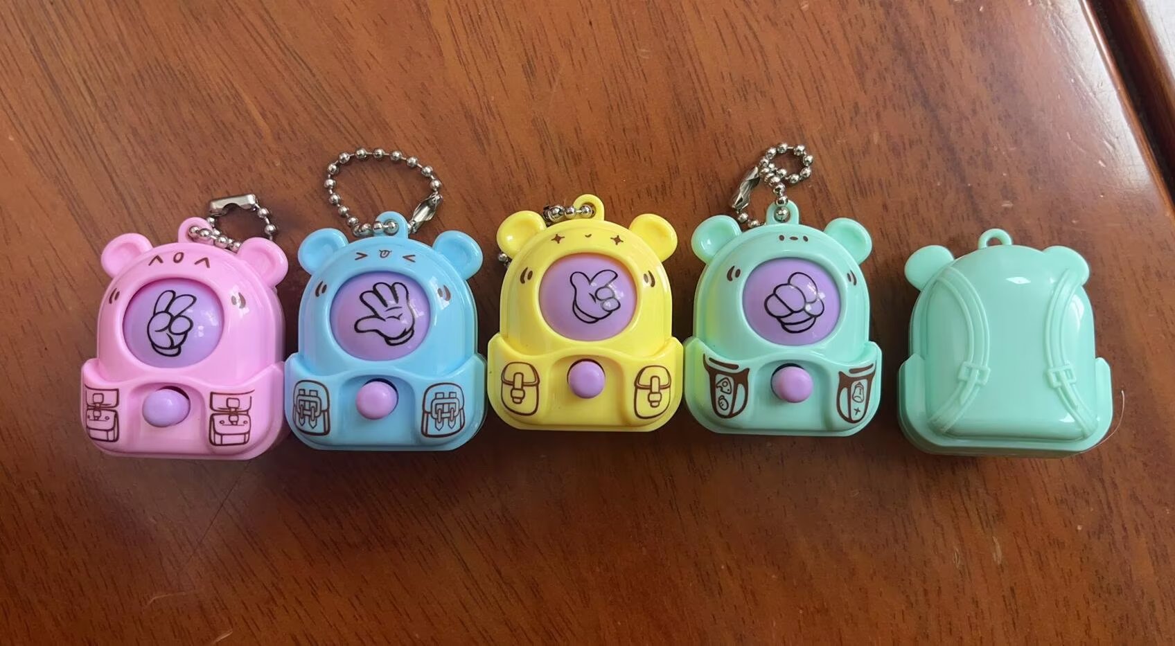 Children's toys, cartoon backpacks, face-changing toys, mini rock-paper-scissors toys, fun gashapon toys, gifts, giveaways, small toys