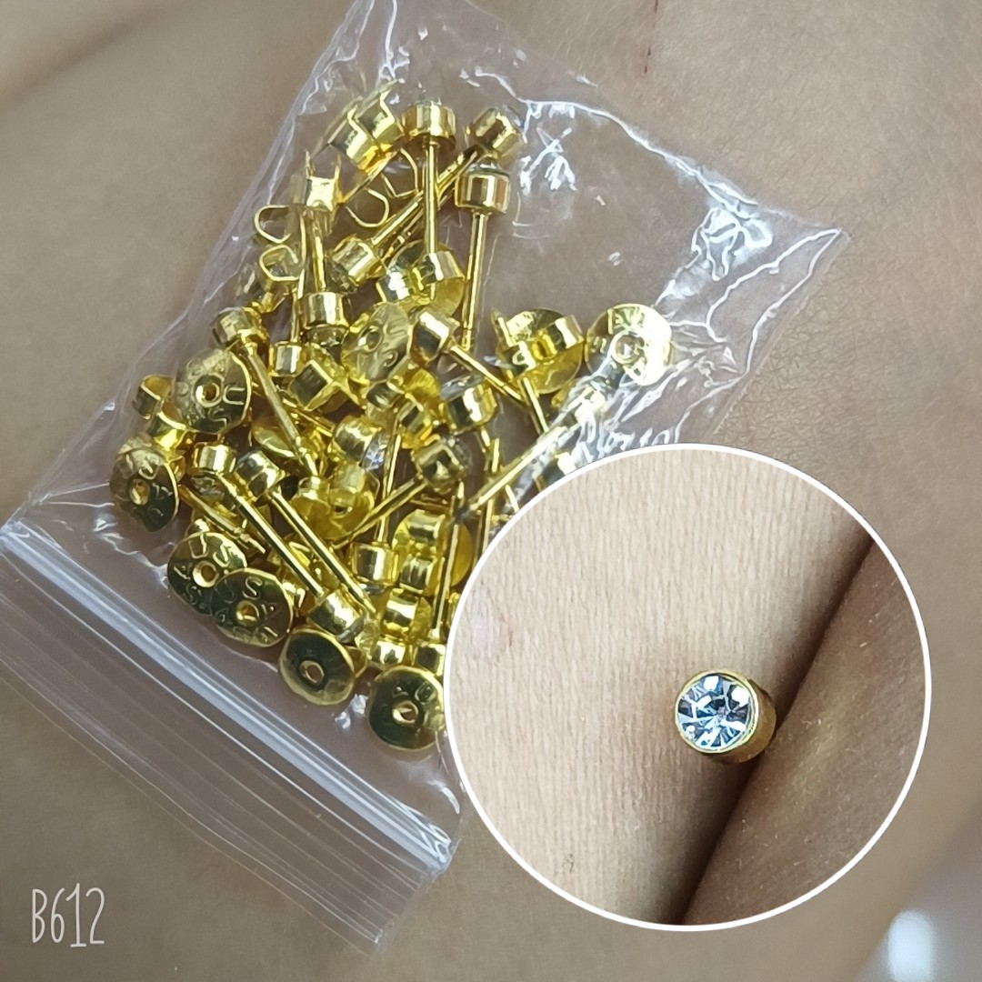 The stud earrings are golden.