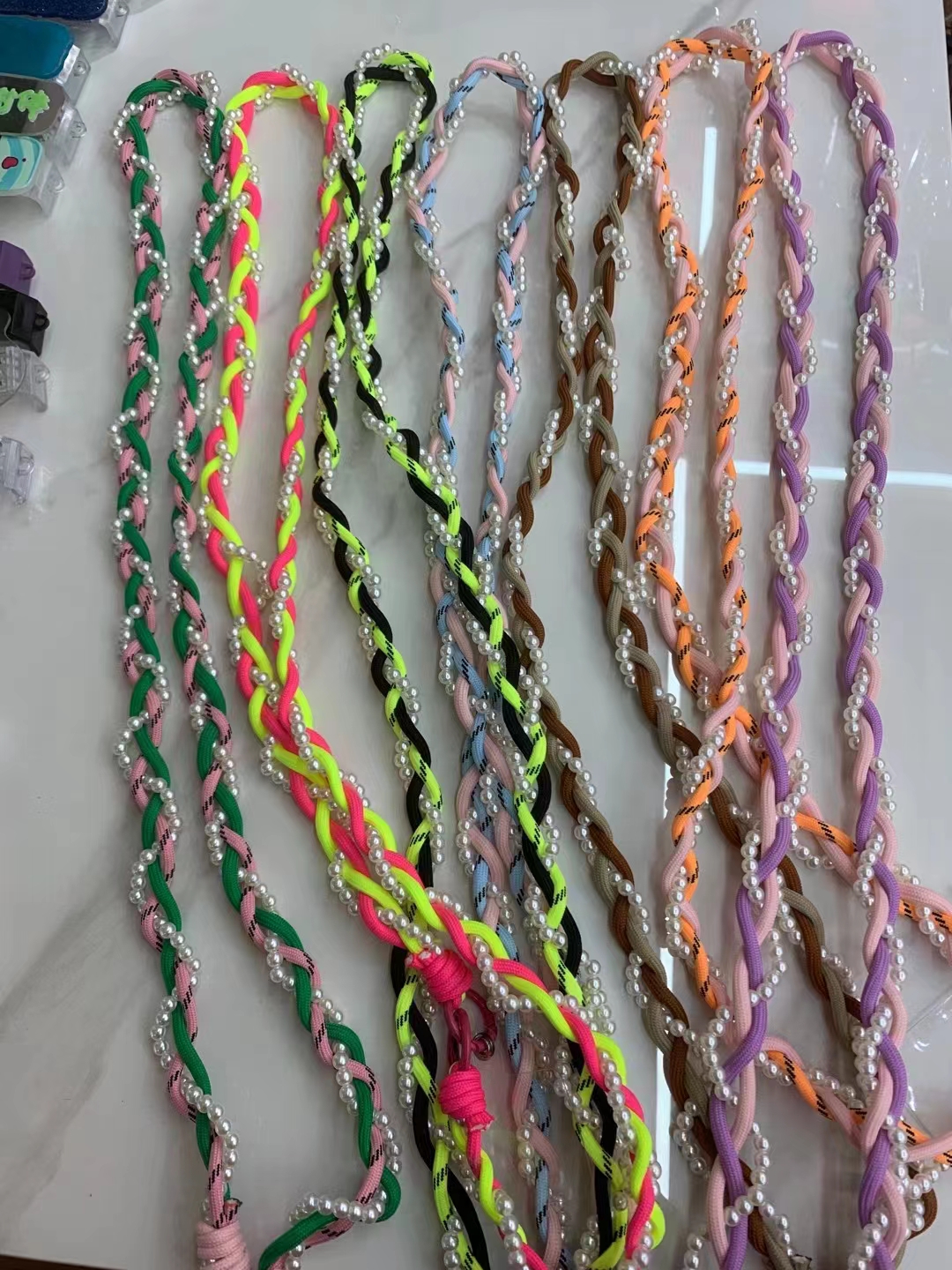 Three strands of woven pearl lanyard