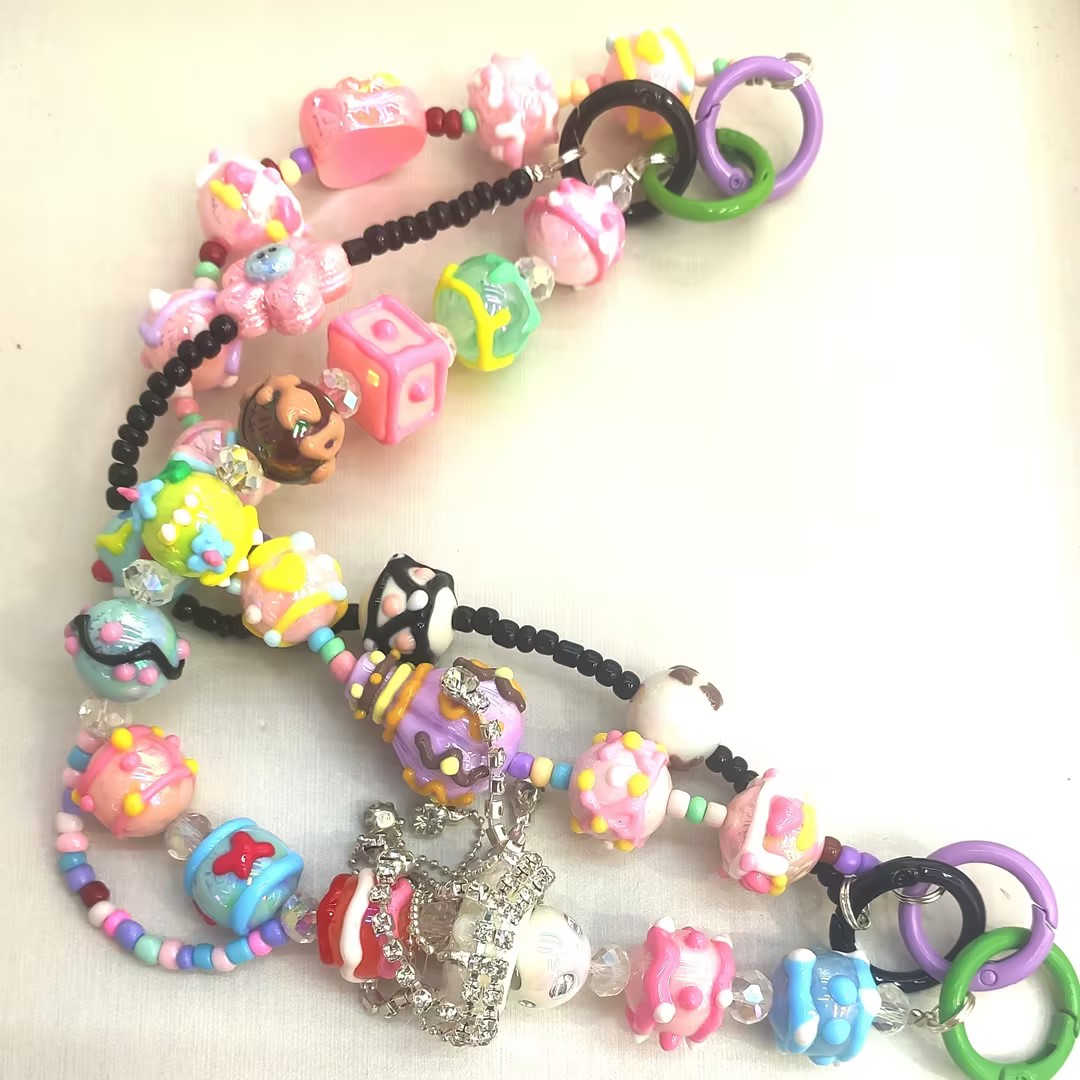 Original multi-functional three-in-one mobile phone chain, mobile phone bead string, bag pendant, candy tassel, pearl luster, high-quality keychain Item Picture