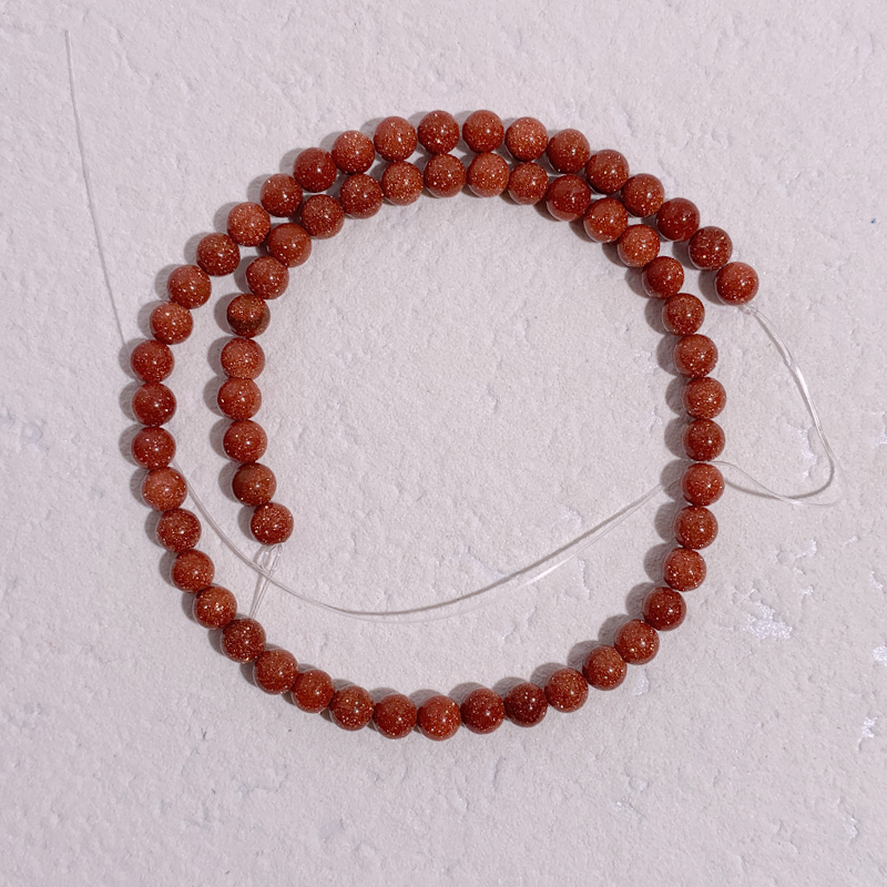 Wholesale of gold sand stone loose beads, semi-finished gold sand stone round beads, DIY jewelry accessories and long strips Application Scenario
