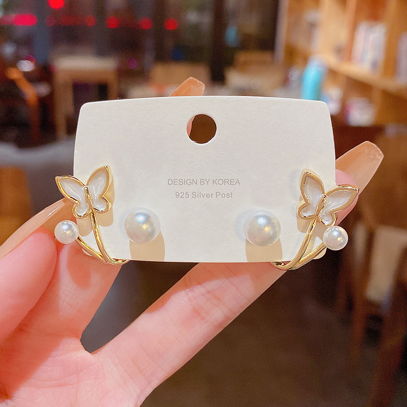 S925 Silver needle light luxury advanced design sense dripping oil bow earrings female ins trend network red the same pearl earrings Application Scenario