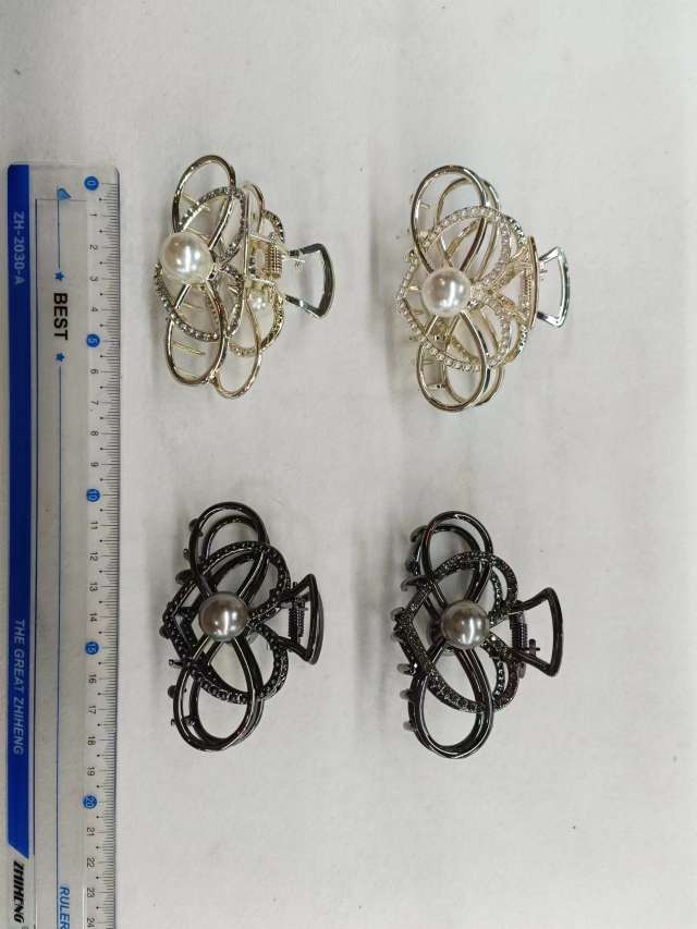 A creative and elegant hair accessory for ladies with a string of pearl heart-shaped clips on the back of the head