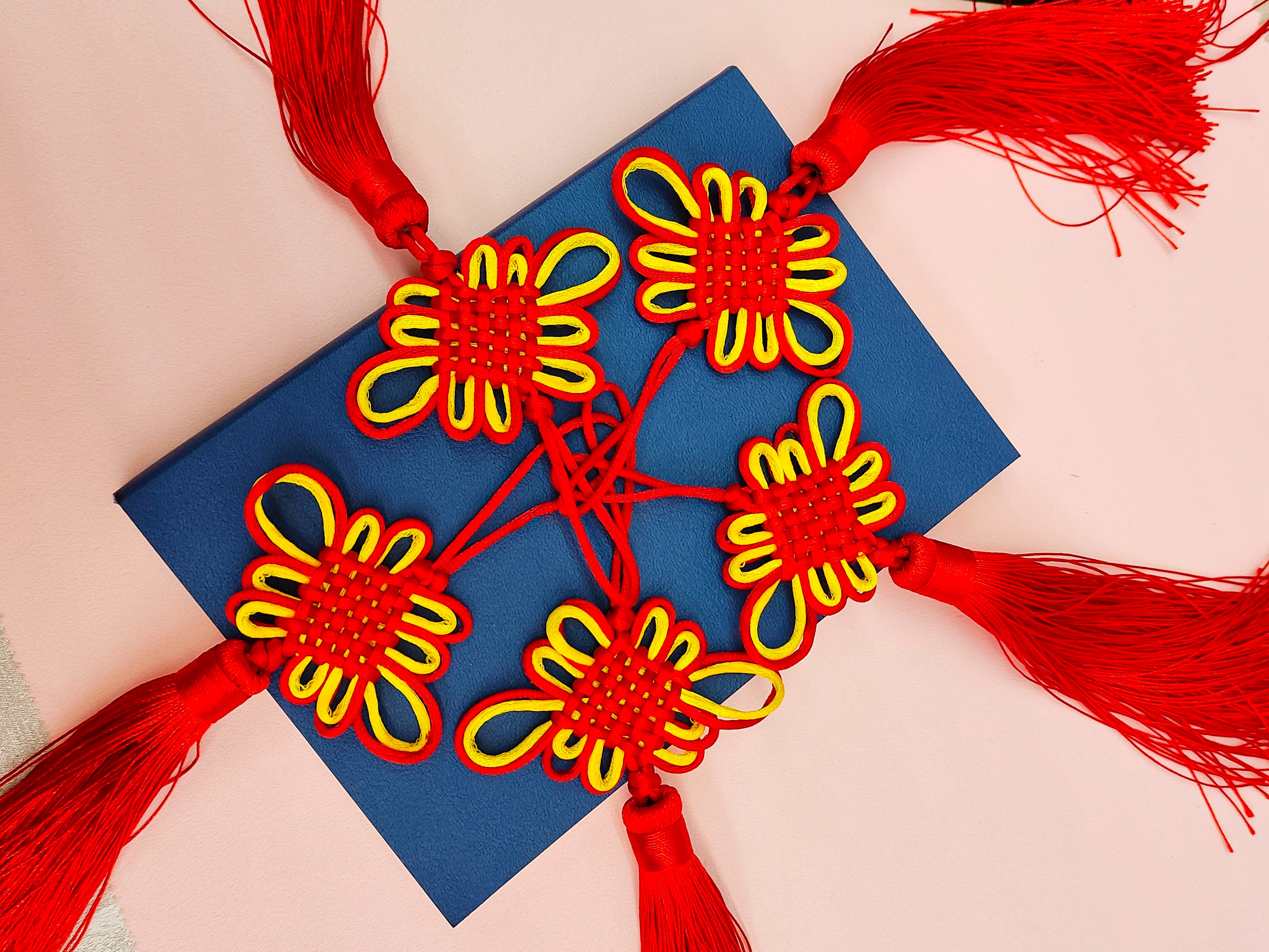 Lotus knot red and yellow two-color Chinese knot accessory, ethnic style exquisite tassel red and yellow flower knot shaping decoration details Picture