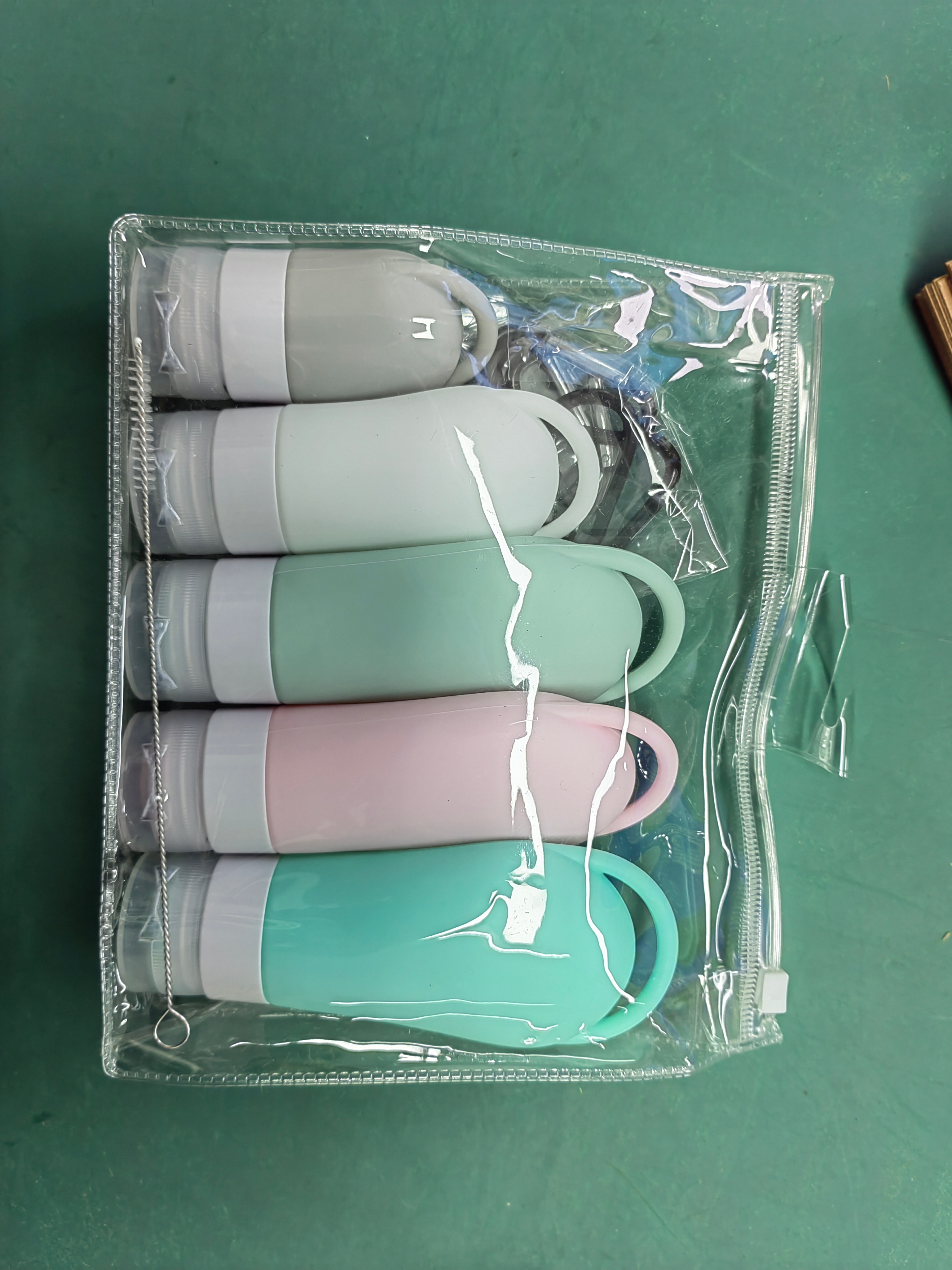 Portable travel portioning bottle set with holes