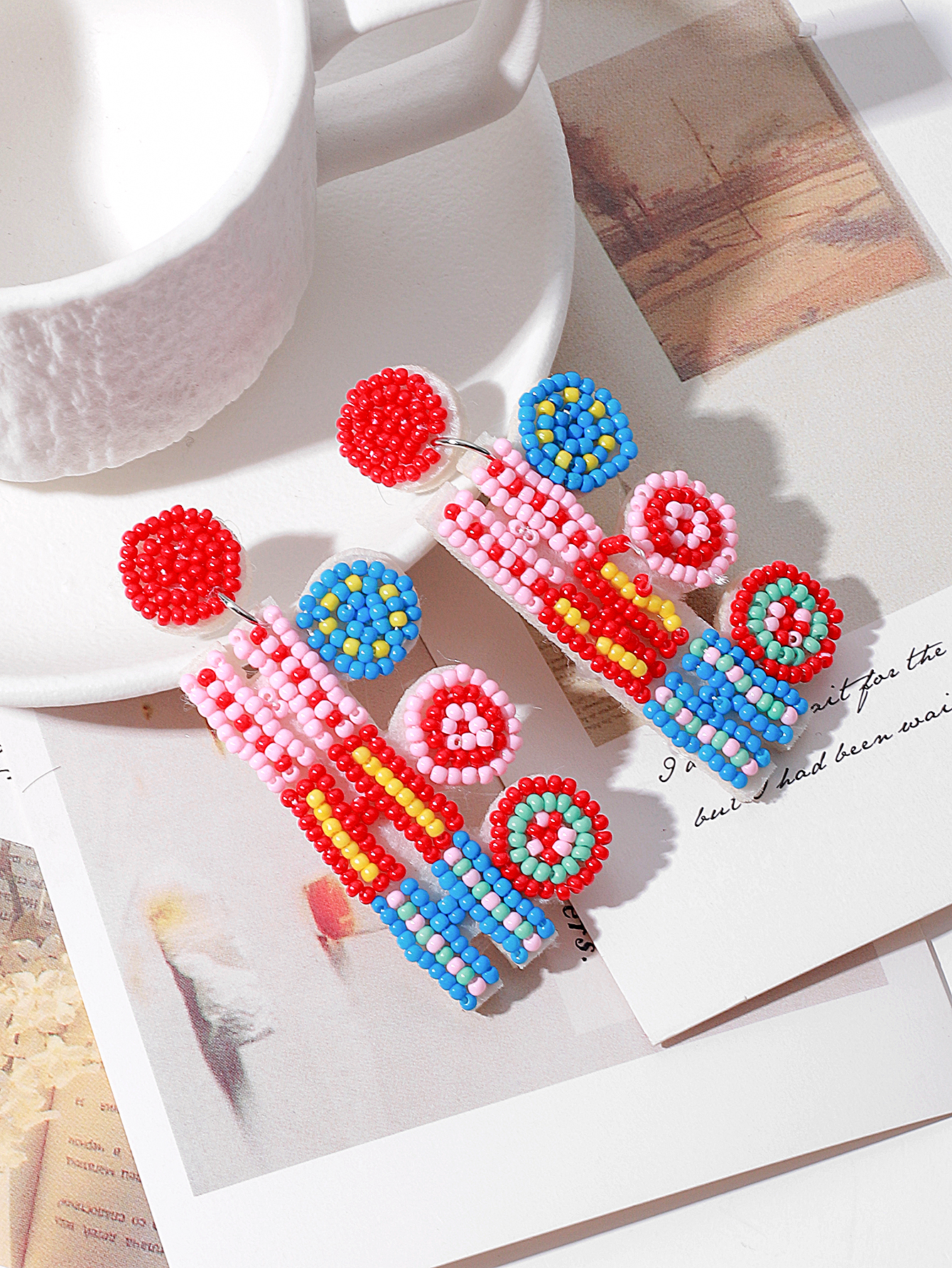 European and American cross-border handcrafted fabric rice beads Christmas HO letter fashion and creative fashion commuting ladies' earrings Item Picture