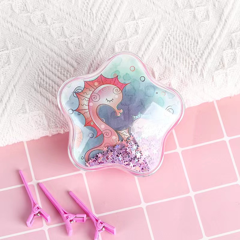 The display box features a creative five-pointed star cartoon star-shaped air cushion comb for children. It is portable, transparent, and has a cute and girlish charm details Picture
