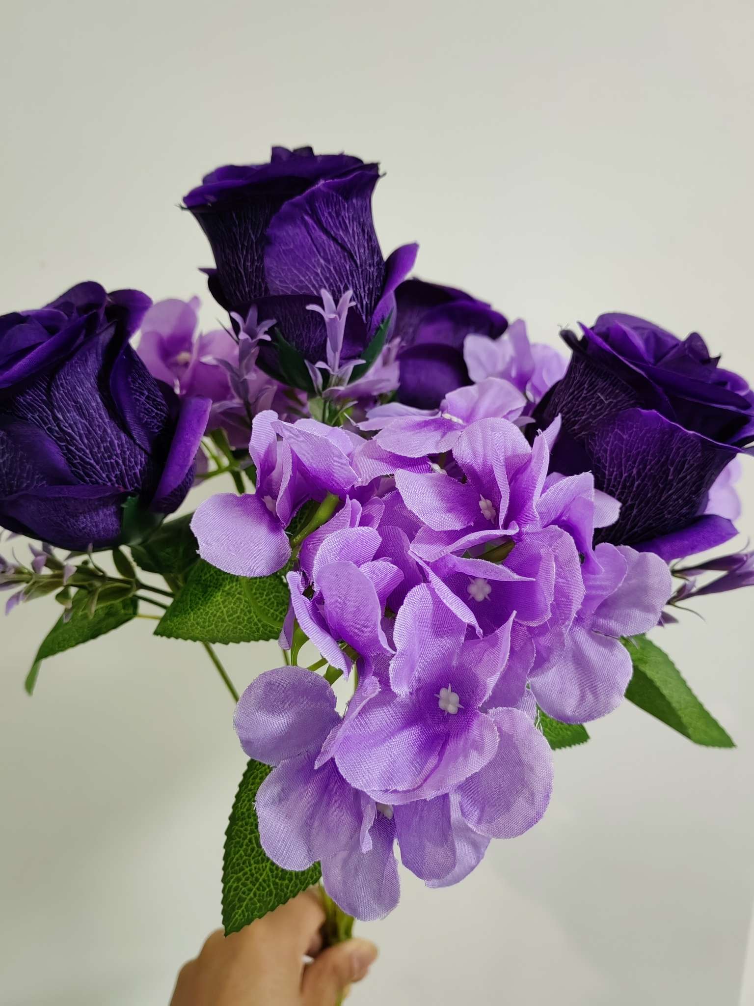 Seven hydrangea purple roses