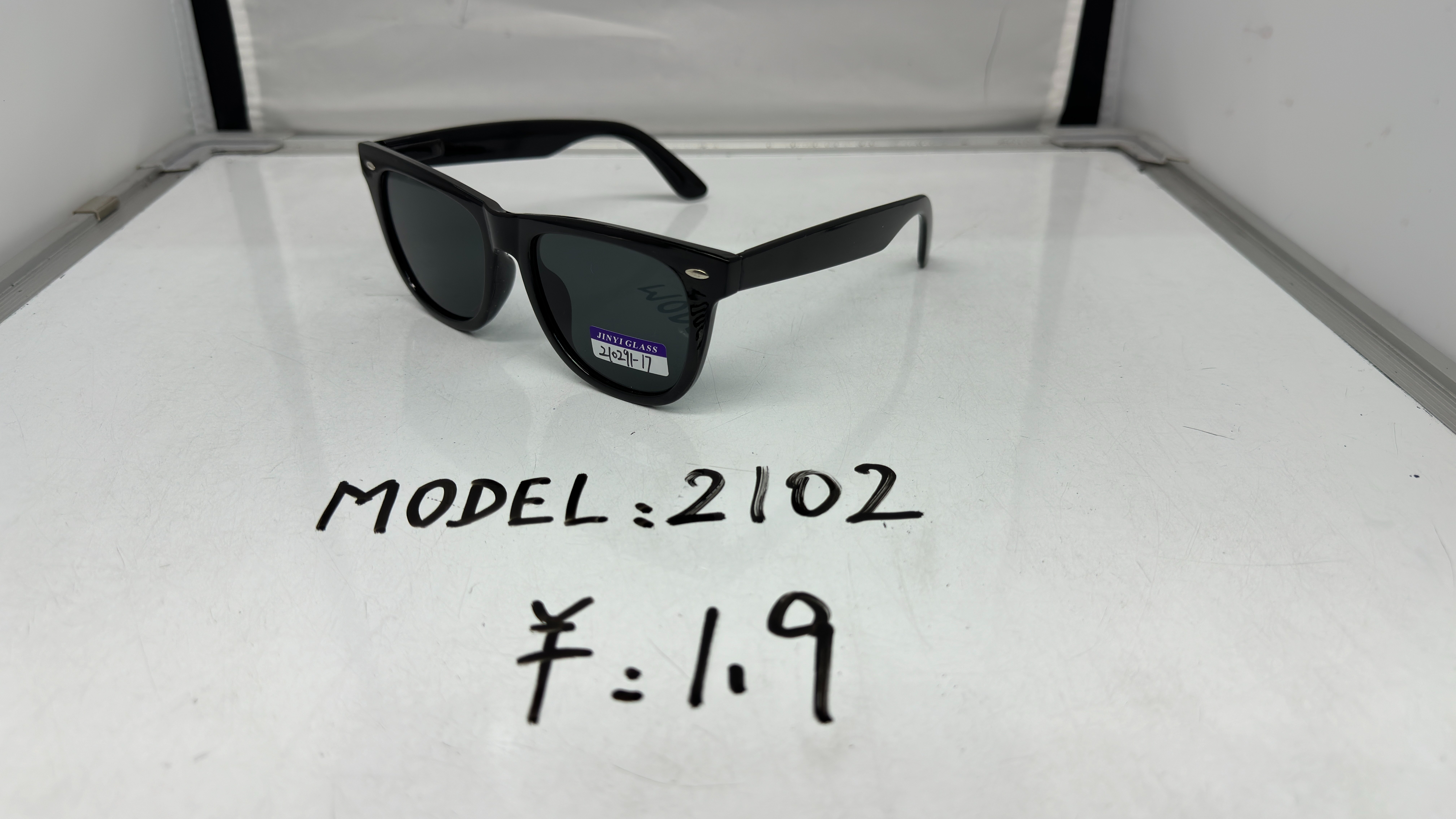 A classic matte black frame with black acrylic lenses and plastic sunglasses with rice studs