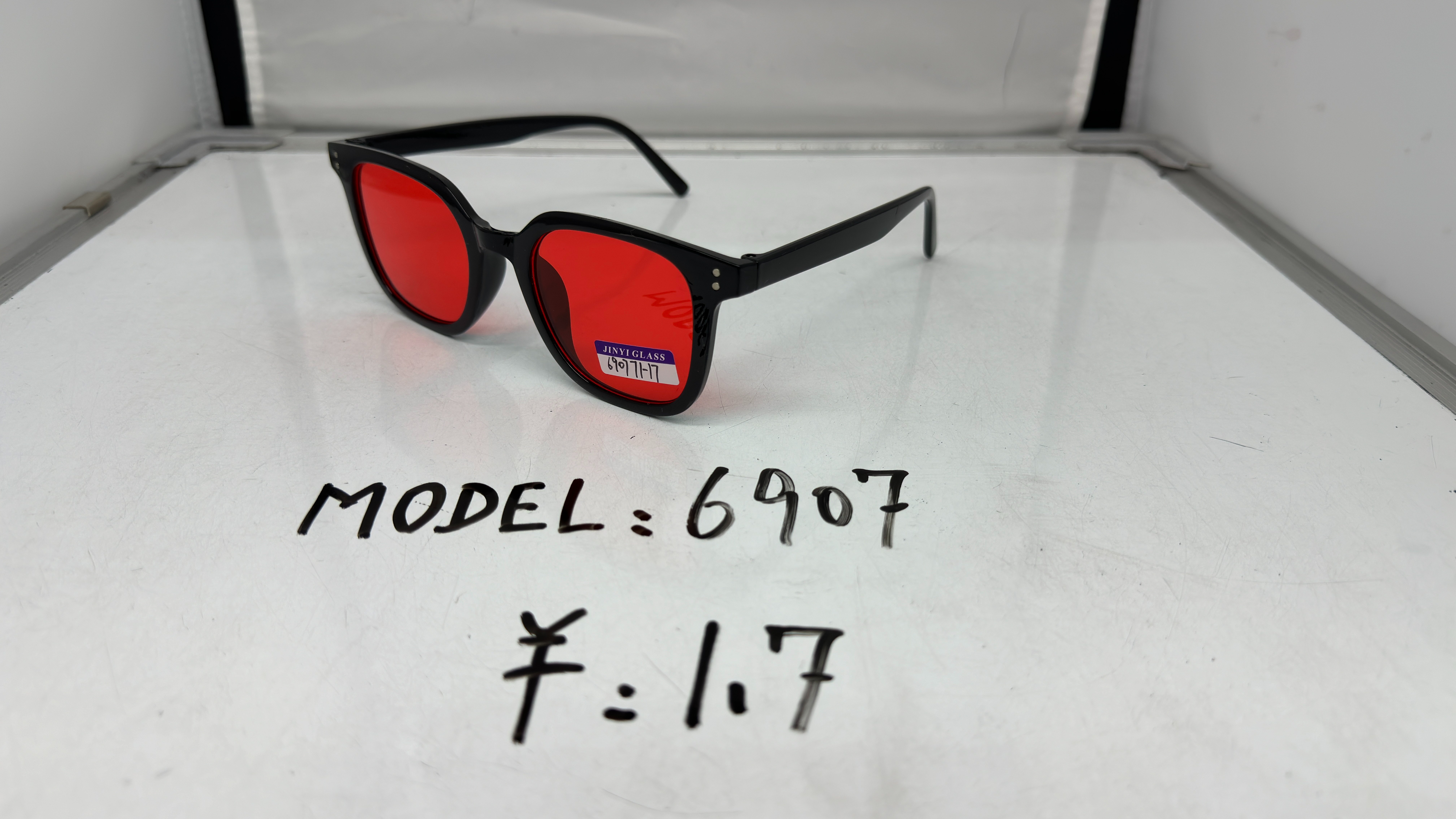 Fashionable vertical row round nails, black frame, red acrylic lens plastic sunglasses