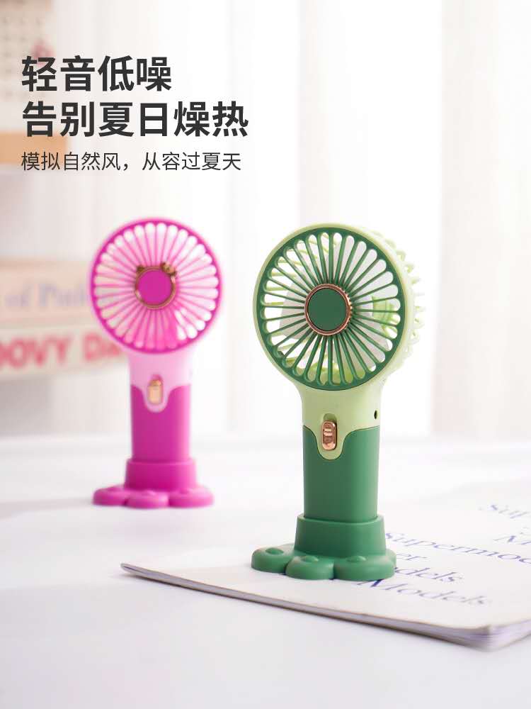 简约便携式手持小风扇usb充电手机支架迷你静音学生礼品电扇白底实物图
