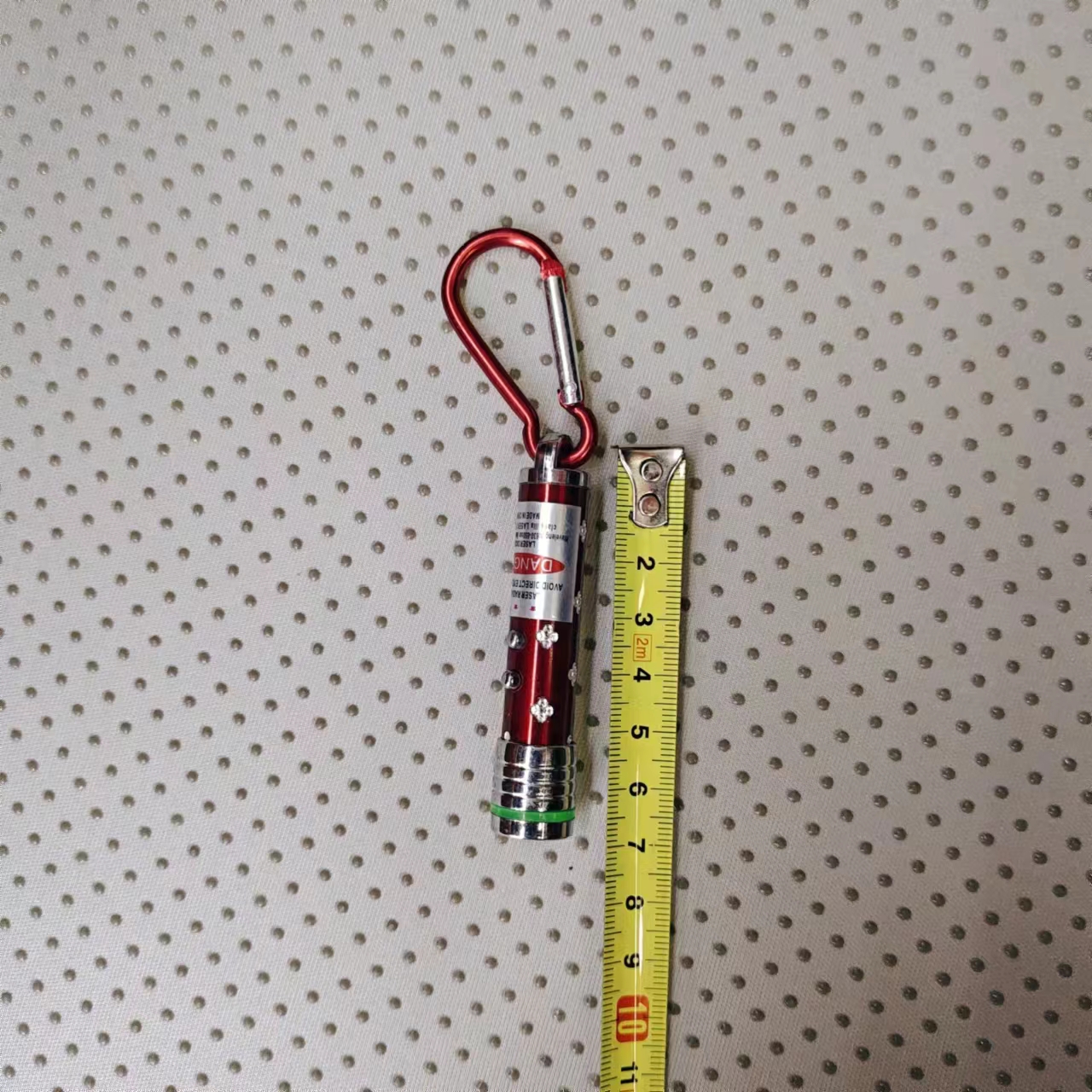 Wholesale of laser lights, plum blossom poles, aluminum buckles, flash laser lights, practical gifts, 5-yuan store, direct sales of children's luminous toys from the manufacturer Item Picture
