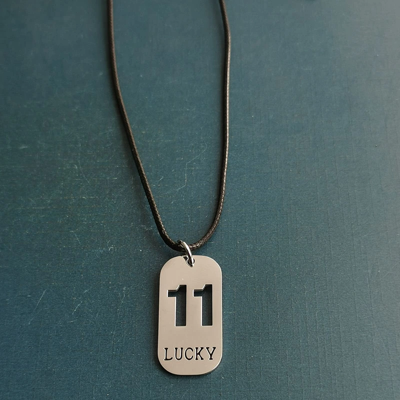 Cross-border foreign trade hollowed-out lucky number eleven keychain, brushed military brand titanium steel stainless steel necklace pendant detail image 11