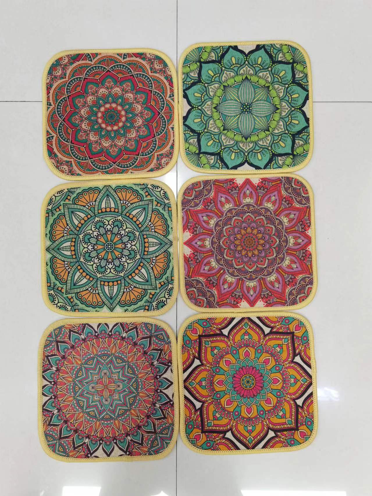 The new square ins linen printed tablecloth, fine linen printed absorbent anti-slip mat, coaster, mouse pad and bowl pad come in multiple patterns and styles. They feature a Bohemian style with a rubber base and clear printing. The size is 18*18cm Application Scenario